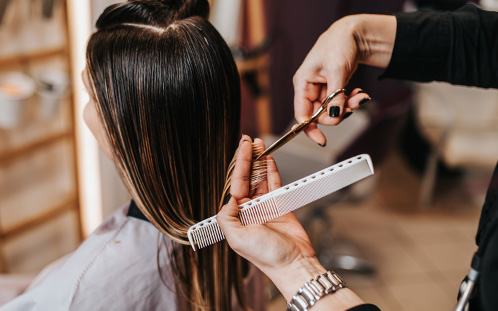 Haircut in progress at salon