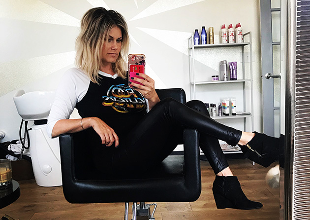 Woman sitting in salon chair